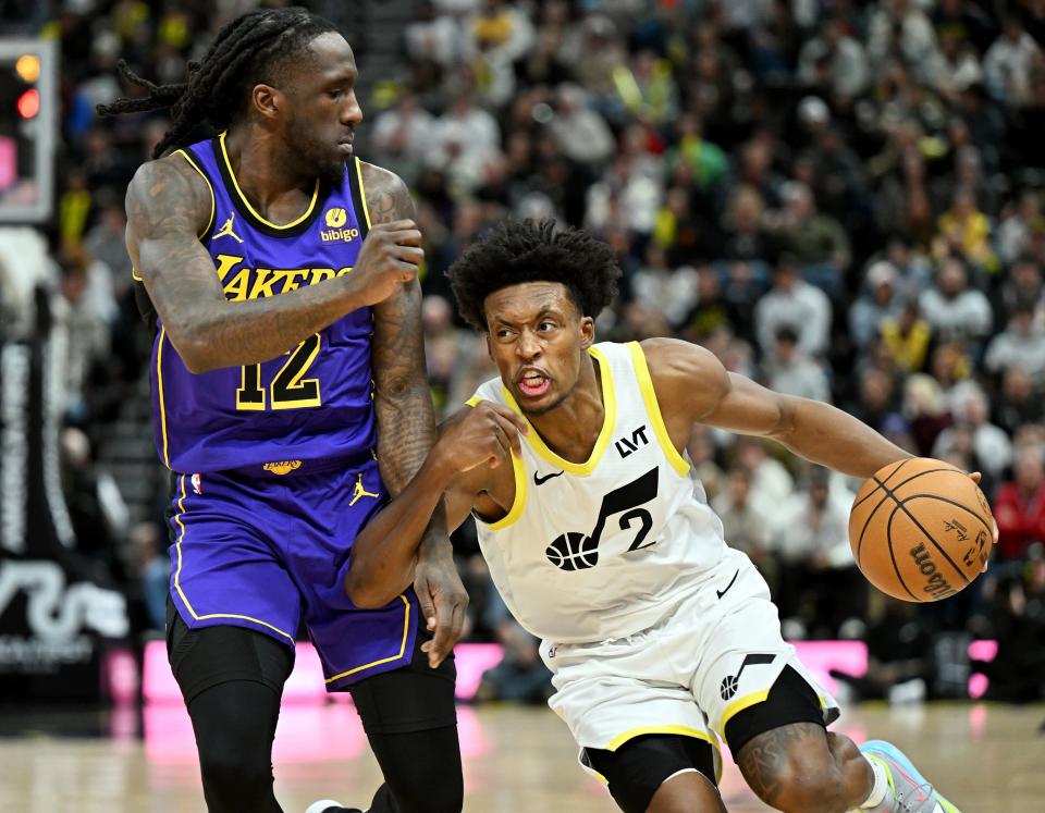 Utah Jazz guard Collin Sexton (2) drives on Los Angeles Lakers forward <a class="link " href="https://sports.yahoo.com/nba/players/5643" data-i13n="sec:content-canvas;subsec:anchor_text;elm:context_link" data-ylk="slk:Taurean Prince;sec:content-canvas;subsec:anchor_text;elm:context_link;itc:0">Taurean Prince</a> (12) as Utah and Los Angeles play at the Delta Center in Salt Lake City on Saturday, Jan. 13, 2024. | Scott G Winterton, Deseret News