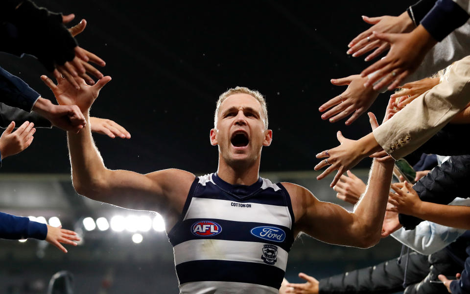 Joel Selwood, pictured here celebrating with Geelong fans after their win over Collingwood.