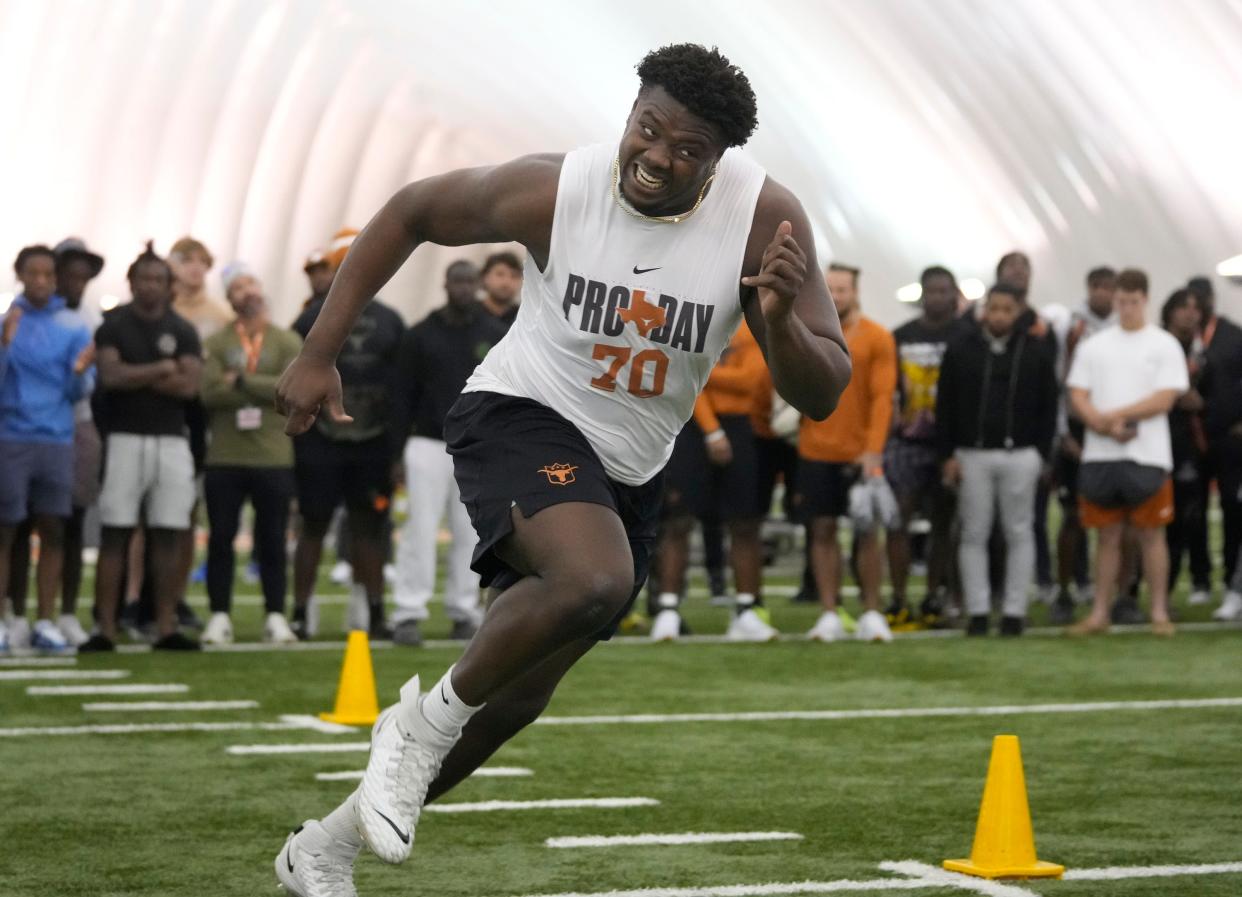 Texas offensive lineman Christian Jones runs through drills at the Longhorn's pro day at Frank Denius Fields in March. Jones had a strong showing at the Senior Bowl and is expected to get drafted on Saturday.