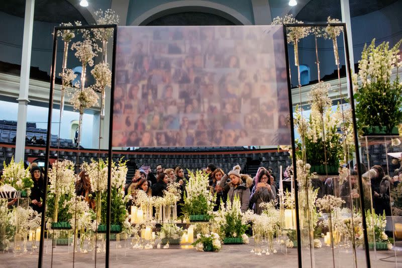 Mourners attend a memorial for the victims of a Ukrainian passenger plane which was shot down in Iran