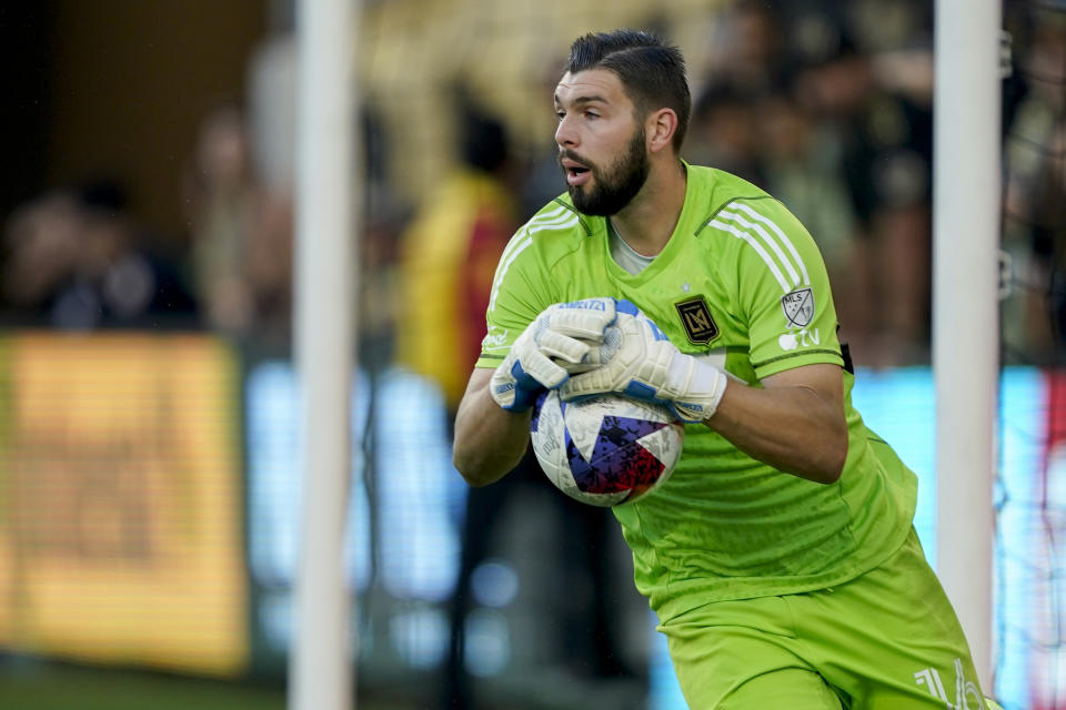 Los Angeles FC goalkeeper Maxime Crépeau makes a save during the first half of the team's MLS playoff soccer match against the Vancouver Whitecaps on Saturday, Oct. 28, 2023, in Los Angeles. (AP Photo/Ryan Sun)