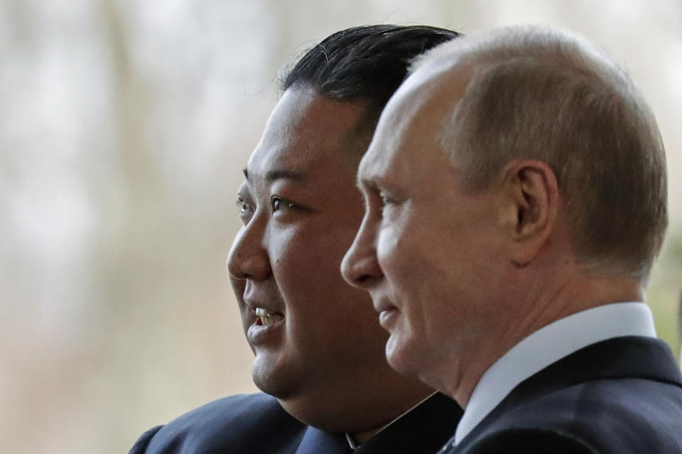 FILE - Russian President Vladimir Putin, right, and North Korea's leader Kim Jong Un pose for photographers during their meeting in Vladivostok, Russia, Thursday, April 25, 2019. U.S. officials expect Kim to visit Russia in the coming days to seal a possible deal on munitions as Moscow seeks to replenish its military machine by tapping Pyongyang's huge arsenal. (AP Photo/Alexander Zemlianichenko, Pool, File)