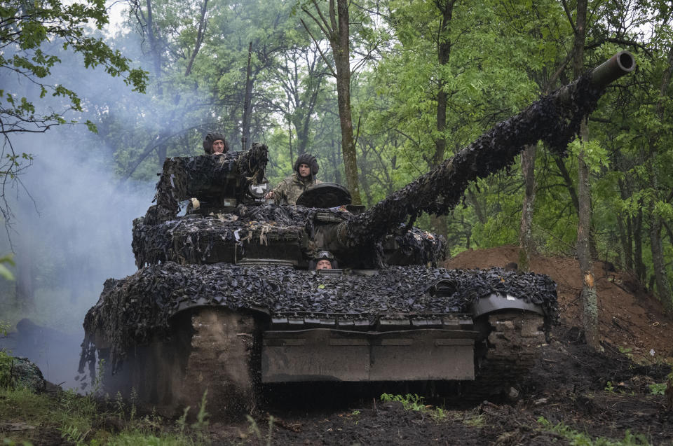 Ukrainian soldiers on a tank ride along the road towards their positions near Bakhmut, Donetsk region, Ukraine, Tuesday, May 23, 2023.(AP Photo/Efrem Lukatsky)