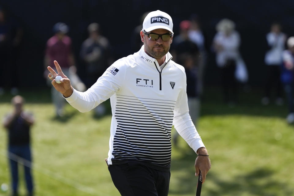 Corey Conners, of Canada, waves after his putt on the 18th hole during the first round of the PGA Championship golf tournament at Oak Hill Country Club on Thursday, May 18, 2023, in Pittsford, N.Y. (AP Photo/Seth Wenig)