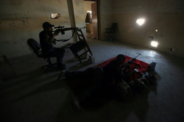 Snipers from the Iraqi forces man their post at the frontline of the Old City of Mosul on March 25, 2017