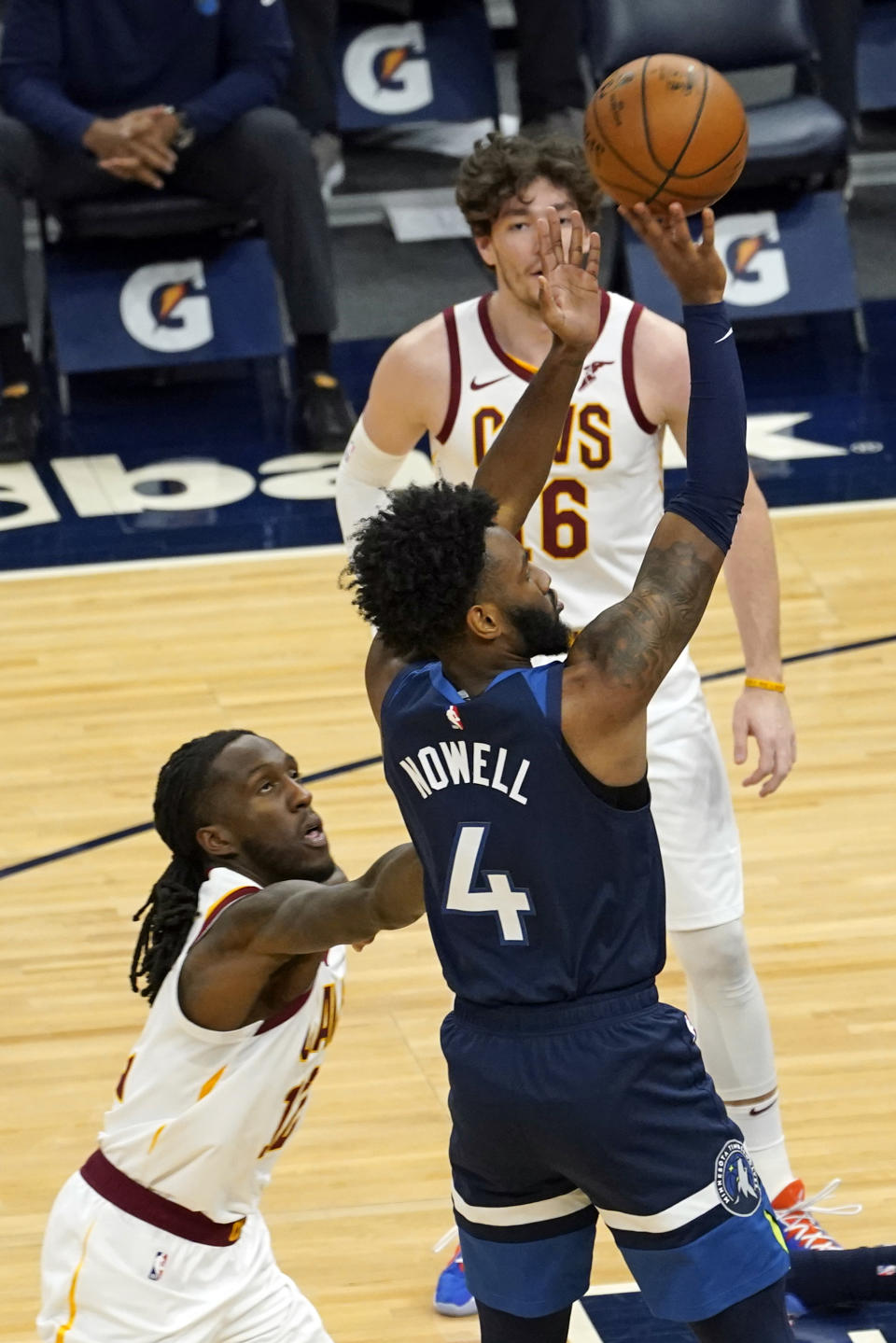 Minnesota Timberwolves' Jaylen Nowell (4) shoots as Cleveland Cavaliers' Taurean Prince, left, defends in the first half of an NBA basketball game Sunday, Jan. 31, 2021, in Minneapolis. (AP Photo/Jim Mone)