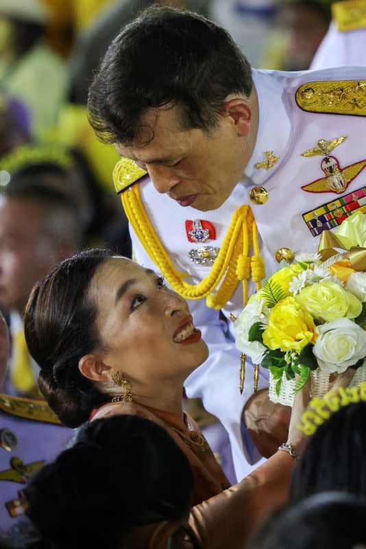 FILE PHOTO: Thailand's King Maha Vajiralongkorn looks at Princess Bajrakitiyabha as they greet royalists, at The Grand Palace in Bangkok