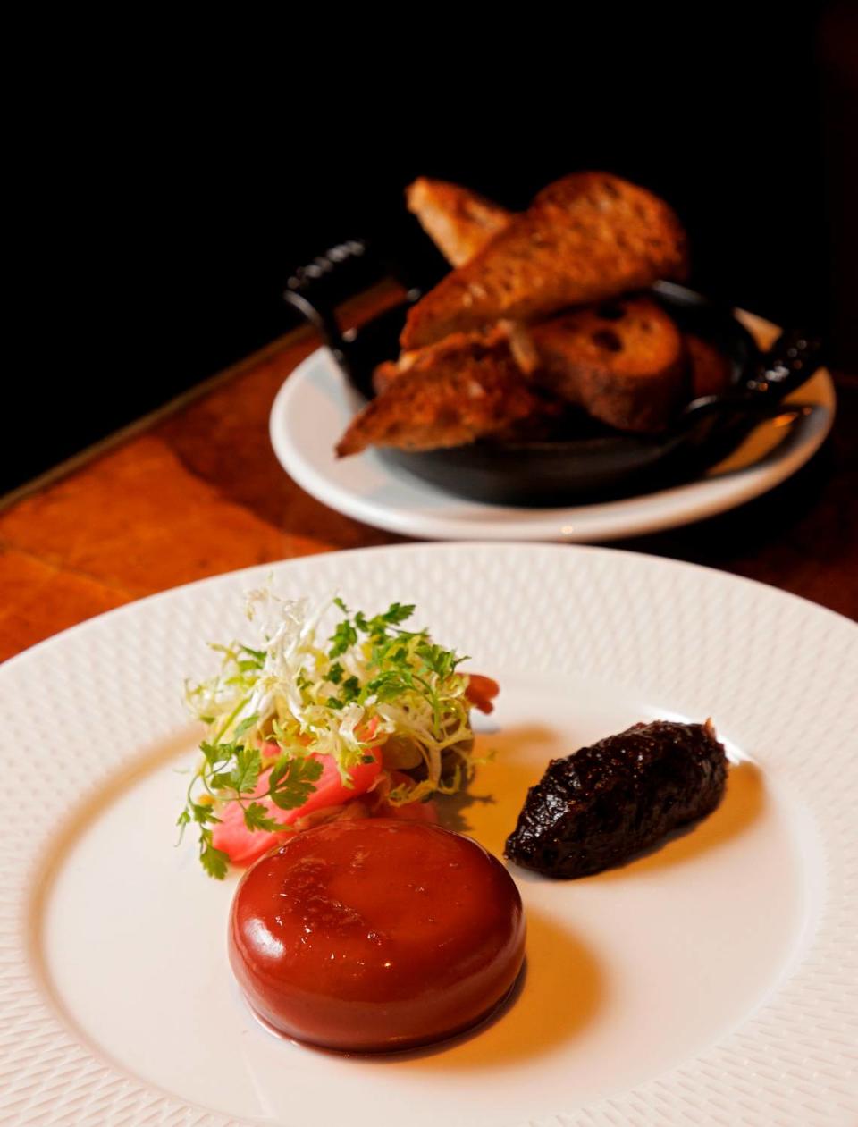 Chicken liver paté with onion marmalade, pickled vegetables and toasted Boulted levain are pictured at Nanas on Wednesday, Nov. 22, 2023, in Durham, N.C. Kaitlin McKeown/kmckeown@newsobserver.com