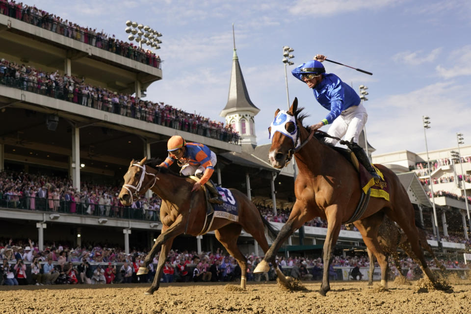 Pretty Mischievous (14), with Tyler Gaffalione aboard, wins the 149th running of the Kentucky Oaks horse race at Churchill Downs Friday, May 5, 2023, in Louisville, Ky. (AP Photo/Jeff Roberson)