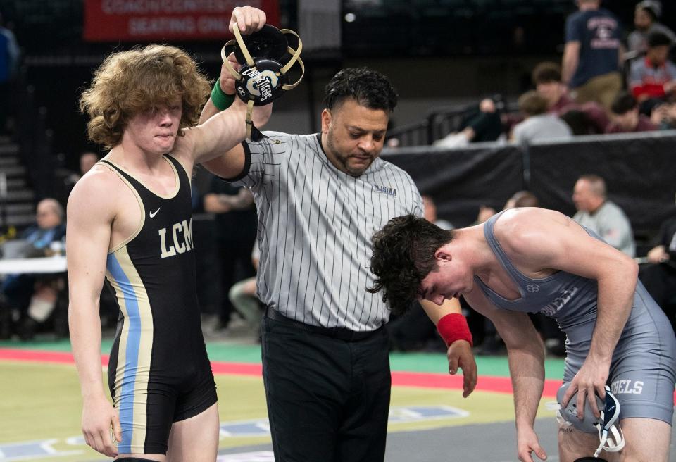 Lower Cape May's Chase Hansen has his arm raised after defeating Howell's Giovanni Scafidi, 9-4, during a 132 lb. bout of the pre-quarterfinal round of the NJSIAA individual wrestling championships tournament at Jim Whelan Boardwalk Hall in Atlantic City on Thursday, March 2, 2023.   