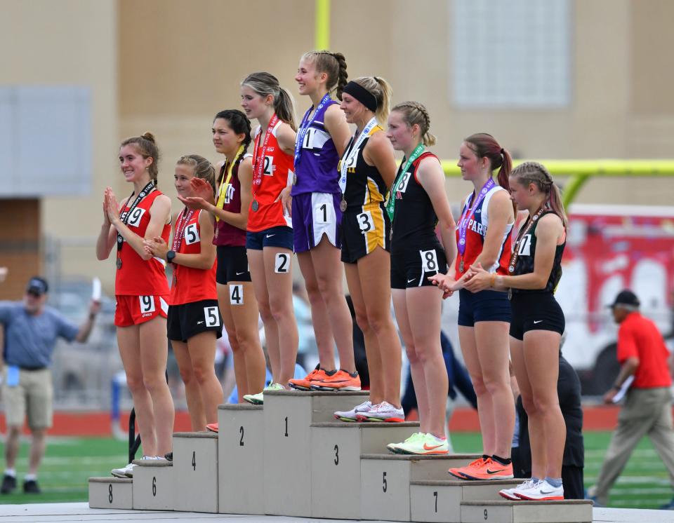 Olivia Goebel of Albany smiles from the top spot on the state championship podium after winning the 3,200-meter run during Minnesota State Track and Field Class 2A meet Friday, June 10, 2022, at St. Michael-Albertville High School.