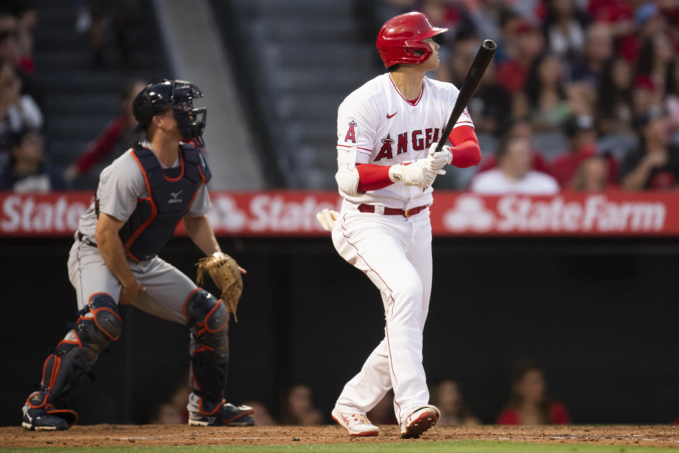 Los Angeles Angels' Shohei Ohtani watches his two-run home run during the third inning of the team's baseball game against the Detroit Tigers in Anaheim, Calif., Saturday, June 19, 2021. (AP Photo/Kyusung Gong)