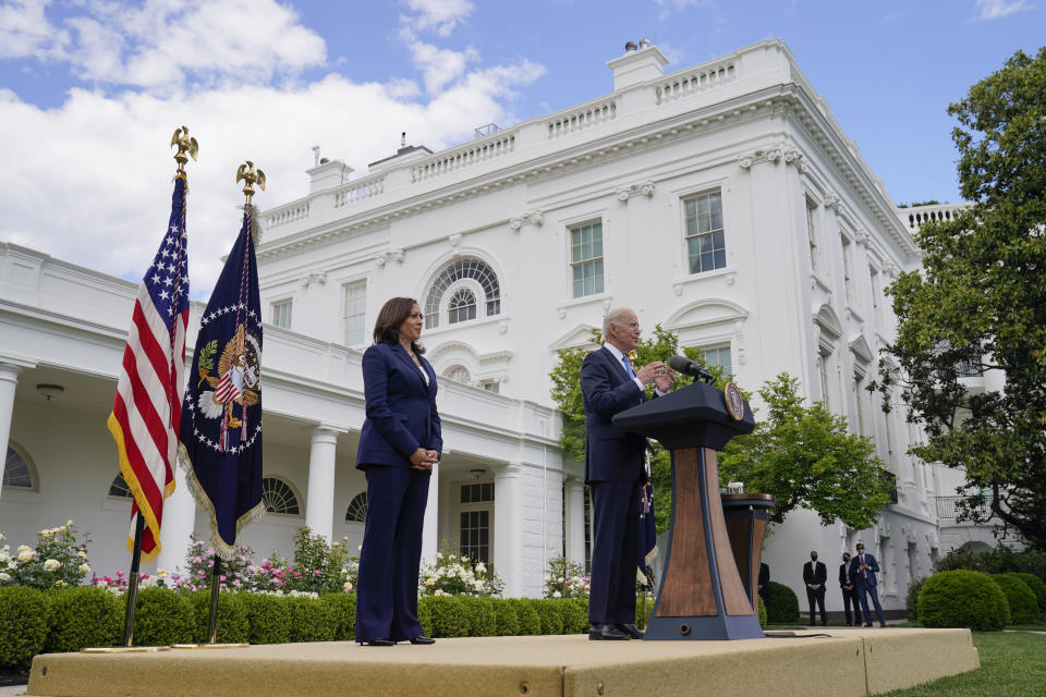 Vice President Kamala Harris listens as President Joe Biden speaks on updated guidance on face mask mandates and COVID-19 response, in the Rose Garden of the White House, Thursday, May 13, 2021, in Washington. (AP Photo/Evan Vucci)