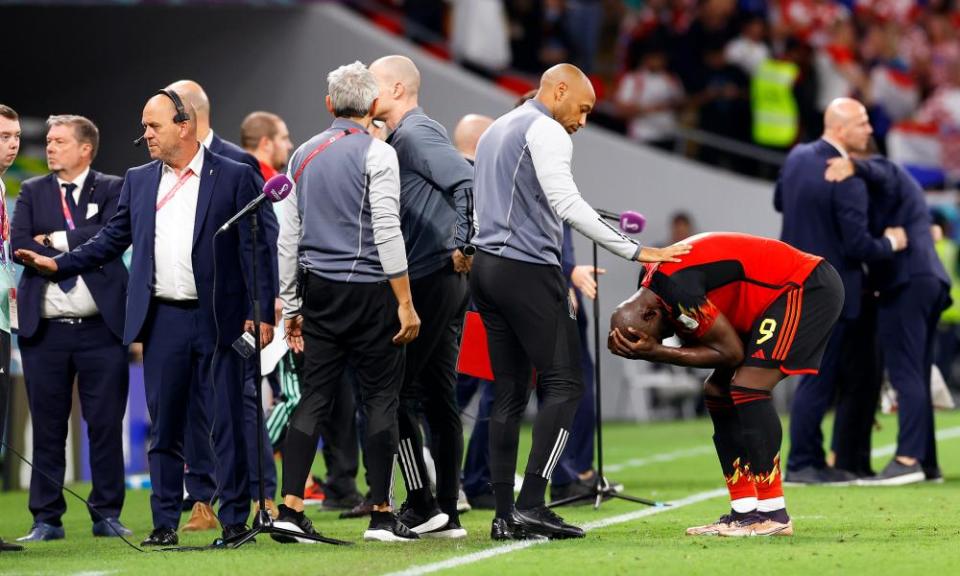 Belgium’s assistant coach Thierry Henry comforts Romelu Lukaku after Belgium’s early exit.