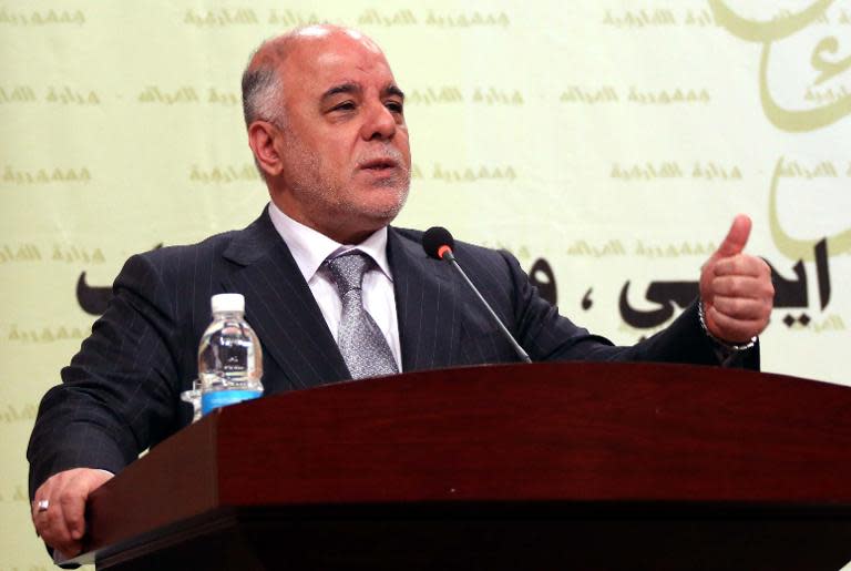 A handout picture released by the Iraqi Prime Minister's office shows Prime Minister Haider al-Abadi delivering a speech during a meeting of ambassadors in Baghdad on March 31, 2015