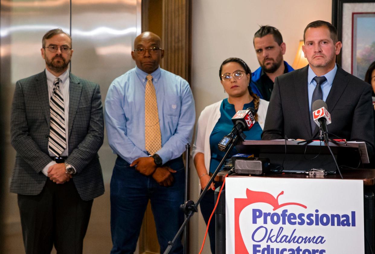 Professional Oklahoma Educators general counsel Blake Sonne, who represents five of six Oklahoma City teachers who were fired for refusing to wear masks, speaks during a press conference Nov. 4 in Norman. Four of the teachers stand behind him, from left: Jason Widener, James Taylor, Grace Trick and Nelson Trick II.
