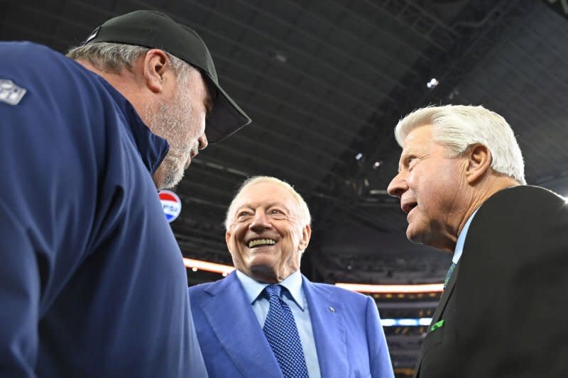 Dallas Cowboys owner Jerry Jones (C) said cited Mike McCarthy's (L) past playoff success as one of the reasons for keeping the coach in 2024. File Photo by Ian Halperin/UPI