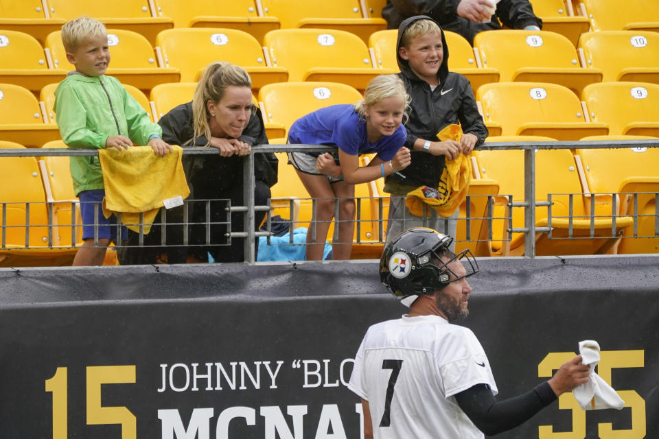 Pittsburgh Steelers quarterback Ben Roethlisberger (7) talks with his family in a break from an NFL football practice, Wednesday, Aug. 18, 2021, in Pittsburgh. His five-year-old son Bodie is at left, his wife, Ashley Harlan, then seven-year-old daughter Baylee, and eight-year-old Benjamin. (AP Photo/Keith Srakocic)