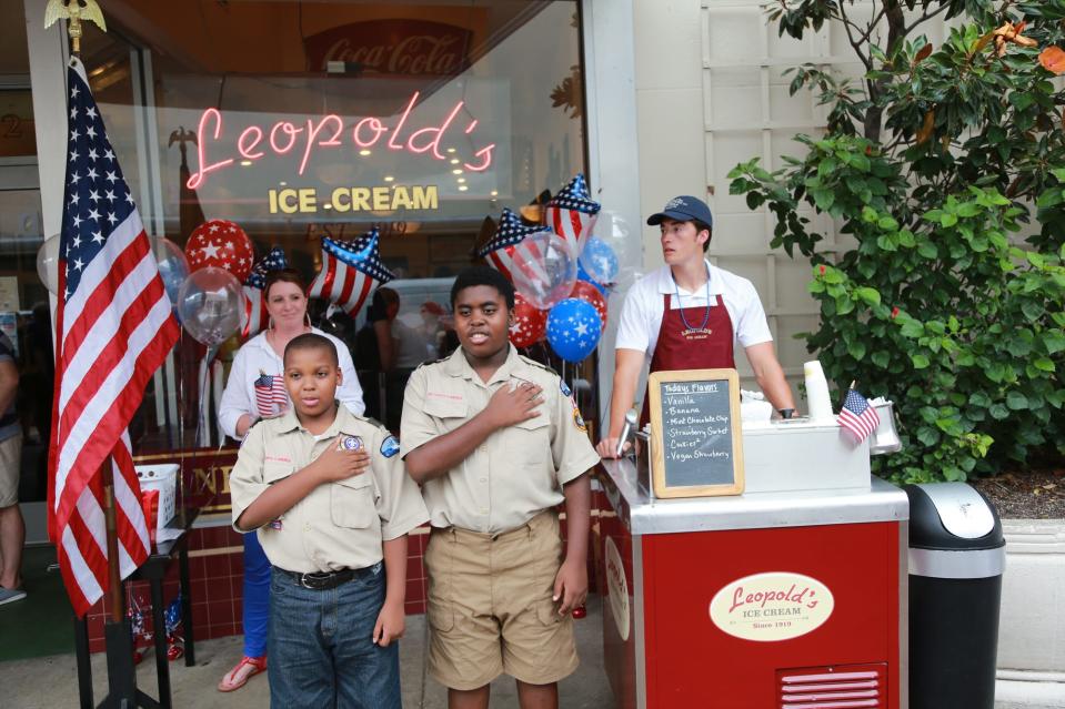 Boy Scouts Ja'Karii Fegans and Ayden Boston recite the Pledge of Allegiance Thursday during the 2021 kickoff for the annual "I Pledge Project" at Leopold's on Broughton Street. Children 12 and under can recite the Pledge of Allegiance from memory to be rewarded with a free child’s scoop of ice cream.