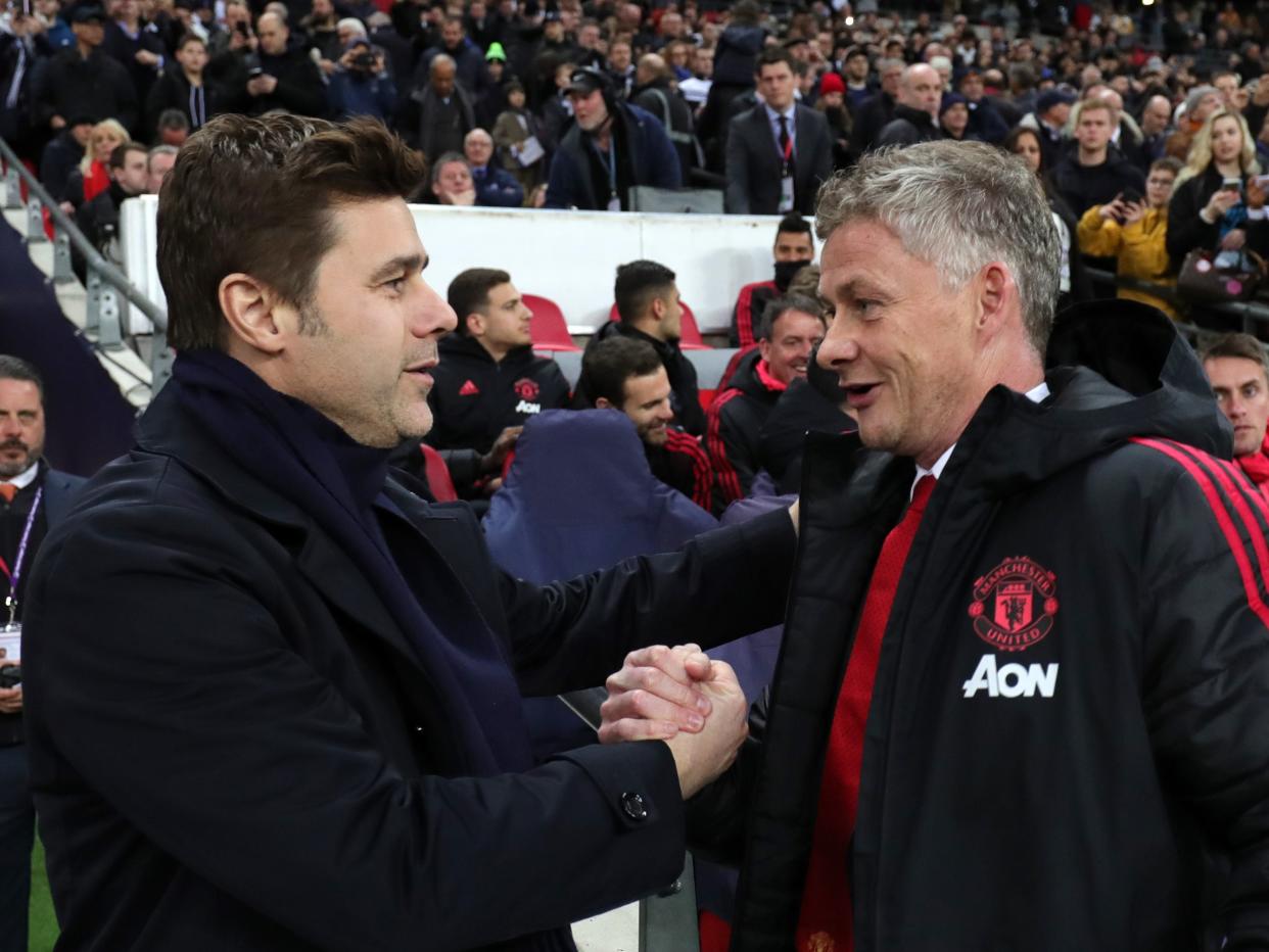 Former Tottenham manager Mauricio Pochettino (left) with Ole Gunnar Solskjaer (Tottenham Hotspur FC via Getty Images)