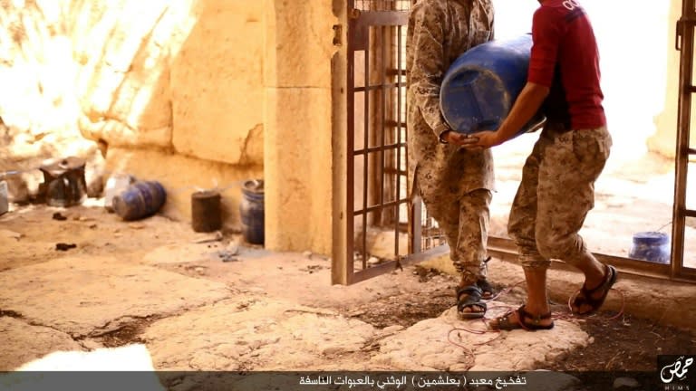 An apparent image from an Islamic State video allegedly shows jihadists preparing explosives in the Baal Shamin temple in Palmyra