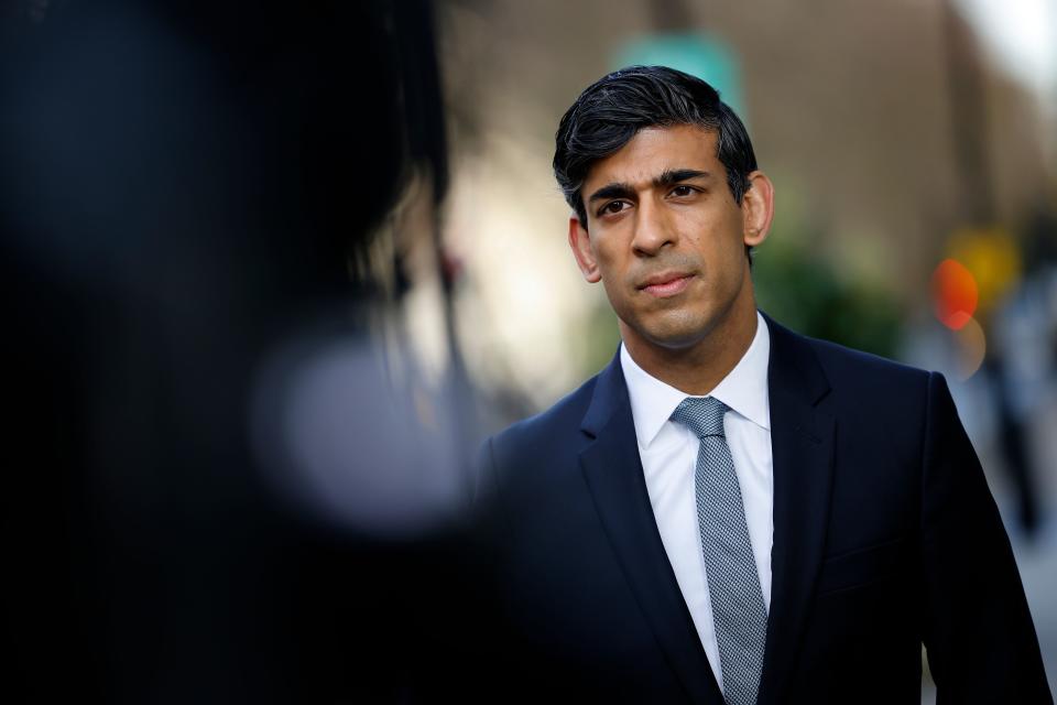 Britain's Chancellor of the Exchequer Rishi Sunak reacts during a media interview after arriving at the BBC in central London on November 22, 2020, to take appear on the BBC political programme The Andrew Marr Show. - Britain's debt is now at its highest level since 1961 as a share of GDP, after the government embarked on a massive spending spree to mitigate the economic effects of the COVID-19 coronavirus pandemic and resulting lockdowns. (Photo by Tolga Akmen / AFP) (Photo by TOLGA AKMEN/AFP via Getty Images)