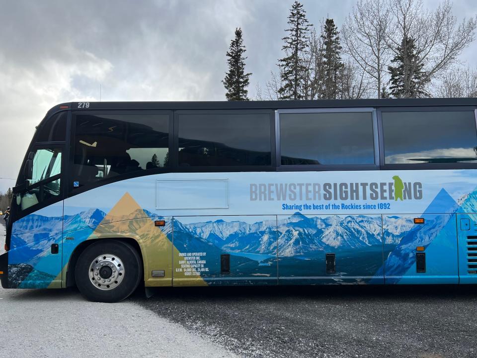 Bus with illustration of the Rocky Mountains with Brewster Sightseeing