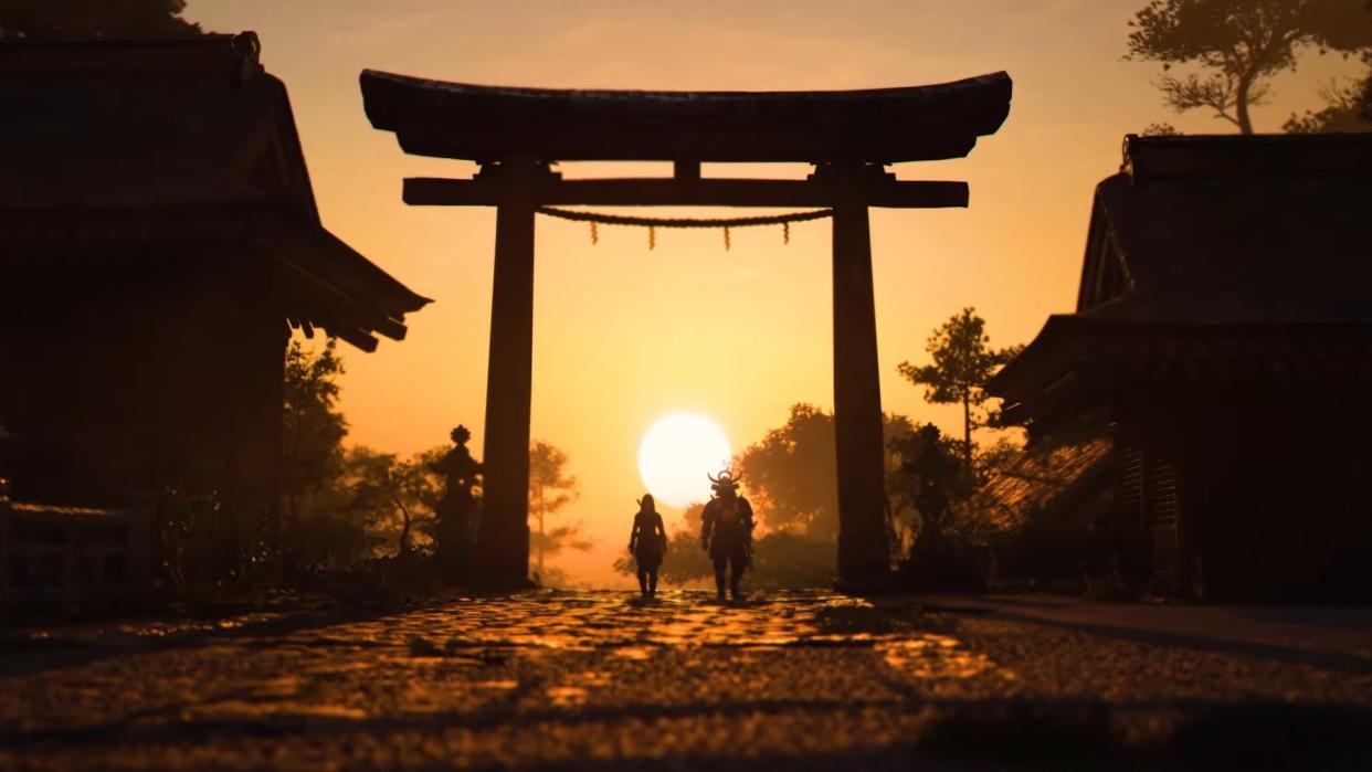  Naoe and Yasuke walk in the sunset in a screenshot from Assassin's Creed Shadows. 