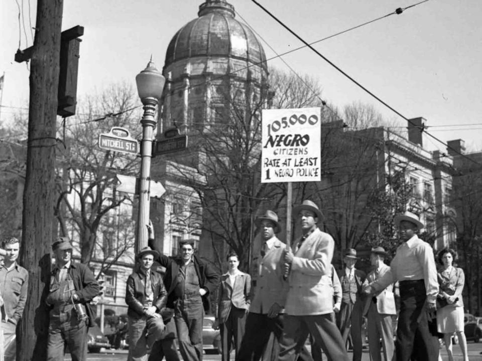 Black people march outside the Georgia State Capitol building in 1946, demanding representation on the police force (Georgia State University Library)