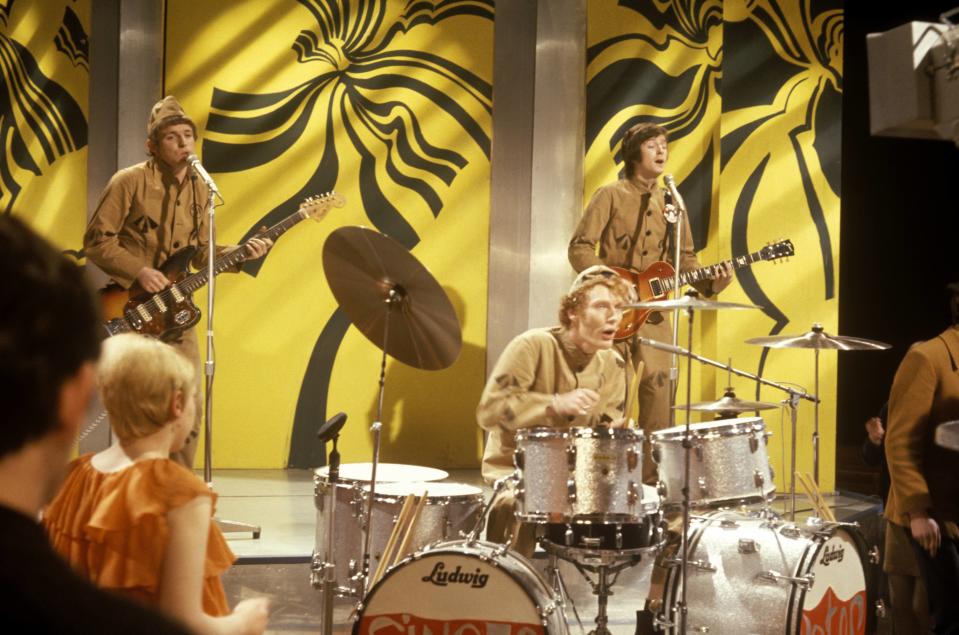 UNITED KINGDOM - DECEMBER 01:  TOP OF THE POPS  Photo of CREAM and Ginger BAKER and Eric CLAPTON and Jack BRUCE, L-R: Jack Bruce, Ginger Baker (playing Ludwig drums, drum kit), Eric Clapton, performing, wearing prison uniforms  (Photo by Ron Howard/Redferns)