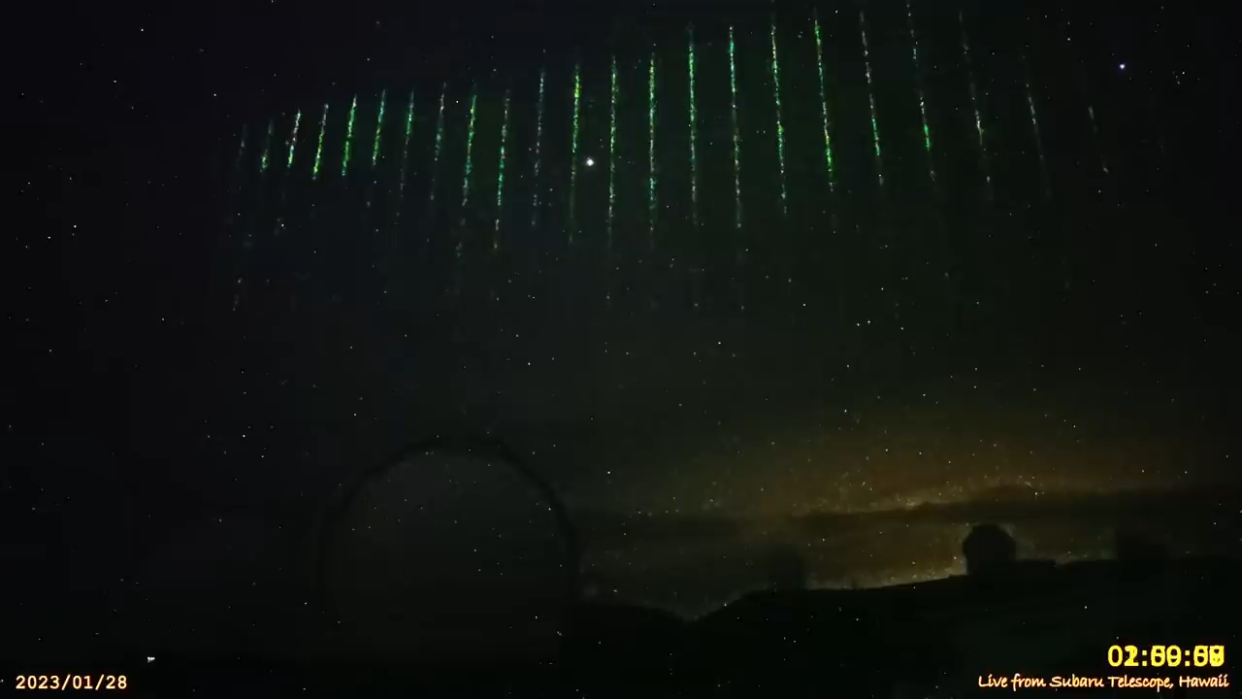 Green streaks of light in the night sky.