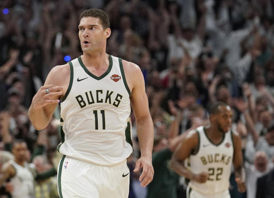 Milwaukee Bucks’ Brook Lopez reacts to his three-point basket during the second half of Game 1 of the NBA Eastern Conference basketball playoff finals against the Toronto Raptors Wednesday, May 15, 2019, in Milwaukee. The Bucks won 108-100 to take a 1-0 lead in the series. (AP Photo/Morry Gash)
