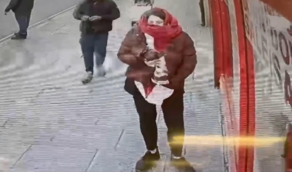 CCTV footage of Constance Marten with baby Victoria under jacket in East Ham (PA)