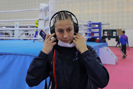 France's Mona Mestiaen removes a mask after her practice session ahead of AIBA Women's World Boxing Championships at Indira Gandhi Indoor Stadium in New Delhi, India, November 12, 2018. REUTERS/Anushree Fadnavis