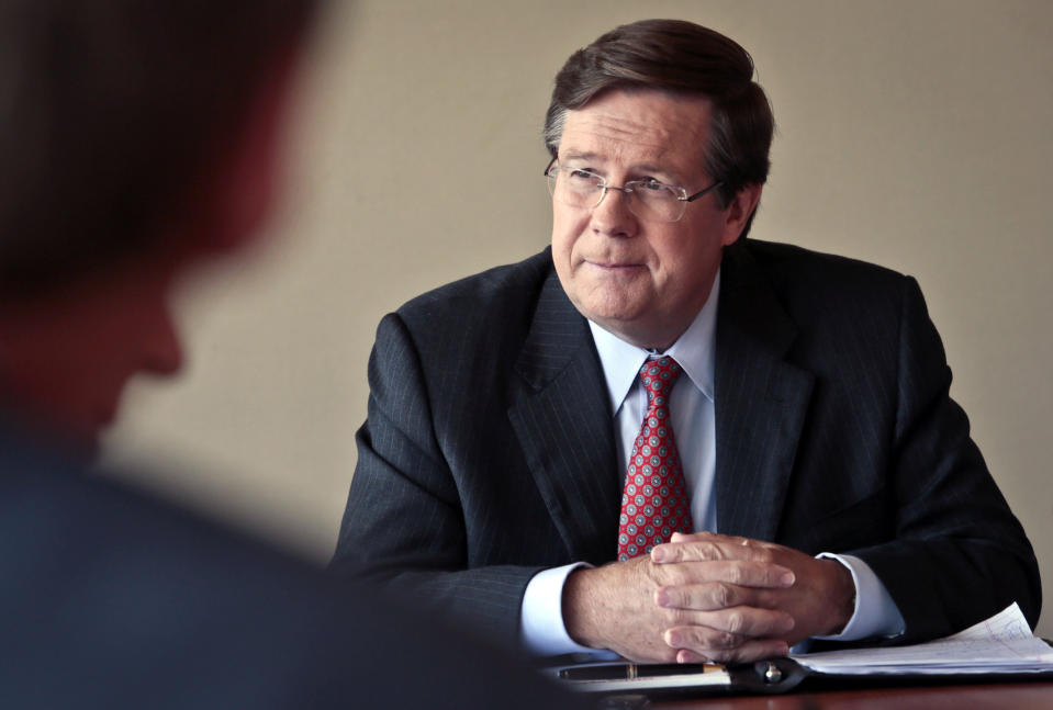 FILE - In this Sept. 26, 2013, file photo Jim Lentz, president and chief operating officer of Toyota in North America, listens during an interview in New York. After 38 years in number of leadership roles with the company, Lentz is retiring, effective April 1, 2020. Lentz, 64, will step down in April as CEO of Toyota Motor North America, and will be replaced by Tetsuo “Ted” Ogawa, who currently chief operating officer, the company said Wednesday, Dec. 11, 2019. (AP Photo/Bebeto Matthews, File)