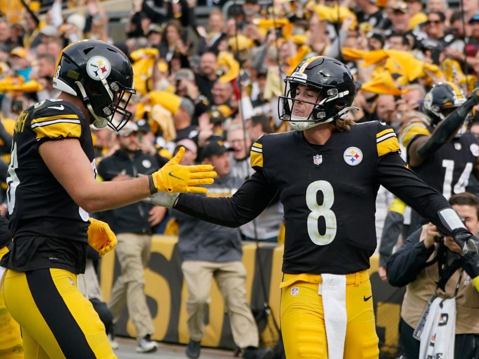 Kenny Pickett celebrates after scoring a touchdown against the New York Jets.