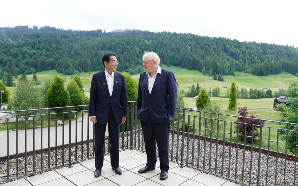 Boris Johnson welcomes Prime Minister of Japan Fumio Kishida ahead of a bilateral meeting during the G7 summit in Schloss Elmau, in the Bavarian Alps, Germany - Stefan Rousseau/PA