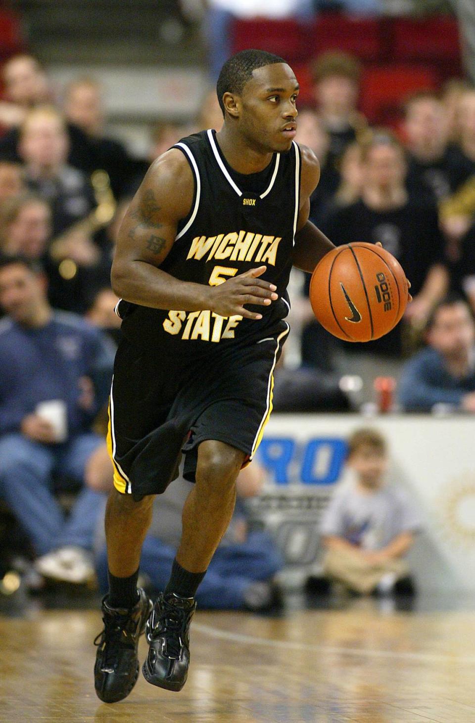 Wichita State guard Randy Burns brings the ball upcourt against Providence, Saturday, Dec. 11, 2004, in Providence, R.I. Burns had 24 points in their 90-86 win. (AP Photo/Stew Milne)