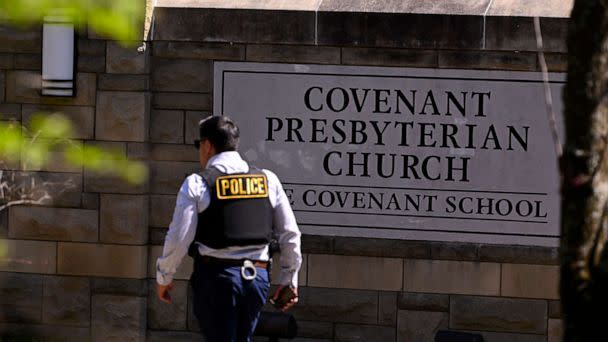 PHOTO: A police officer walks by an entrance to The Covenant School after a shooting in Nashville, Tenn., March 27, 2023. (John Amis/AP)