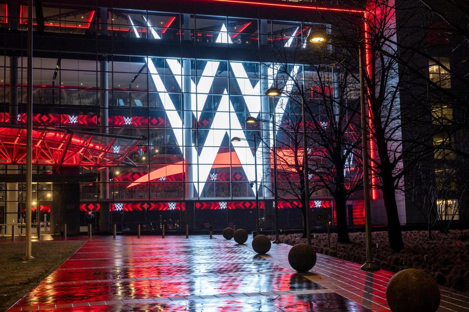 A giant WWE logo shines from the WWE world headquarters on January 28, 2024 in Stamford, Connecticut.