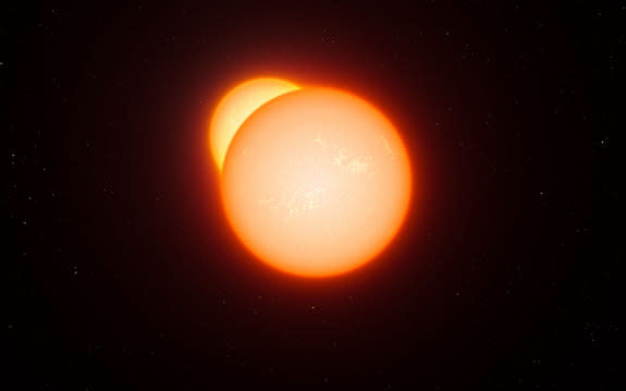 This illustration shows an eclipsing binary star system. As the two stars orbit each other they pass in front of one another and their combined brightness, seen from a distance, decreases. By studying how the light changes, and other properties