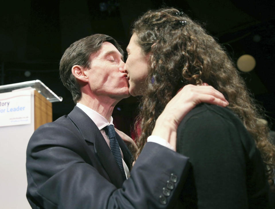 Britain's Conservative MP Rory Stewart kisses his wife Shoshana as launches his campaign to become leader of the Conservative and Unionist Party and Prime Minister at the Underbelly Festival on the south bank of the River Thames, central London. Tuesday June 11, 2019. A longshot candidate, International Development Secretary Stewart has seen his profile soar with a savvy campaign that saw him travelling the country talking to voters, and producing endearingly amateurish social media videos. (Isabel Infantes/PA via AP)