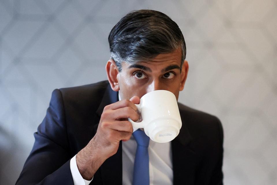 British Prime Minister Rishi Sunak is seen drinking from a mug during a Conservative general election campaign event, in Edinburgh, Scotland, on June 24, 2024.