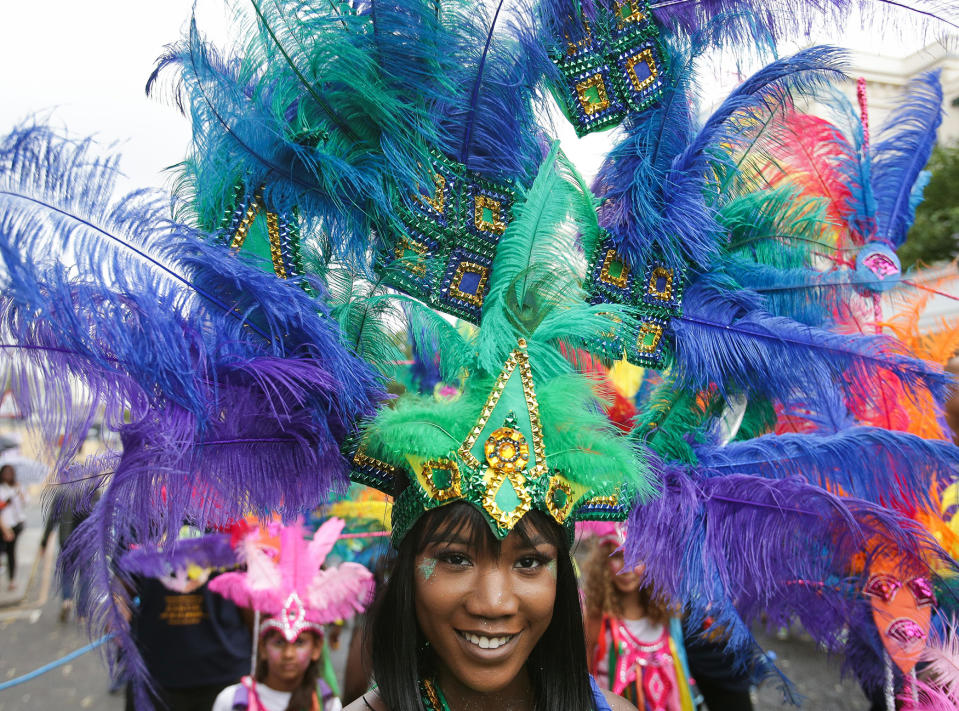 <p>Performers in costume parade on the first day of the Notting Hill Carnival in west London on August 28, 2016. (Photo: DANIEL LEAL-OLIVAS/AFP/Getty Images) </p>