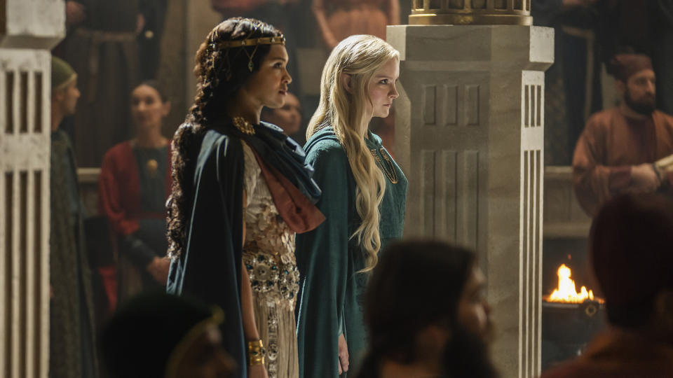 Queen Miriel stands alongside Galadriel in her Numenor court room as she delivers a speech to her people in The Rings of Power episode 4