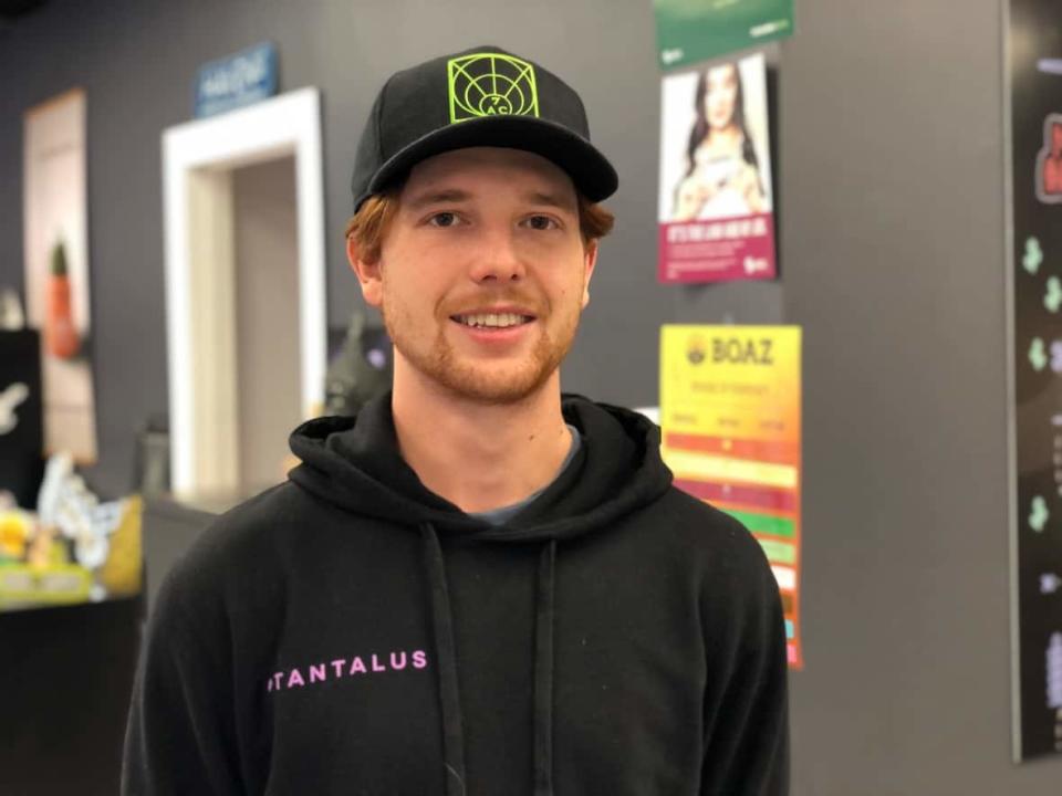 Alex Macyszyn, who works at a northwest Calgary cannabis shop, says the number of cannabis stores in the city makes for stiff competition. (Paula Duhatschek/CBC - image credit)