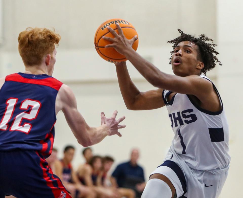 Desert Hot Springs' Jordan Glaspie (1) looks to shoot while guarded by Hesperia Christian's Jared Bragg (12) during the fourth quarter of their game at Desert Hot Springs High School in Desert Hot Springs, Calif., Friday, Feb. 10, 2023. 