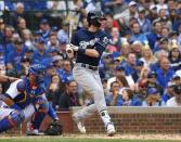 Oct 1, 2018; Chicago, IL, USA; Milwaukee Brewers center fielder Christian Yelich (22) hits an RBI single during the third inning against the Chicago Cubs in the National League Central division tiebreaker game at Wrigley Field. Mandatory Credit: Patrick Gorski-USA TODAY Sports