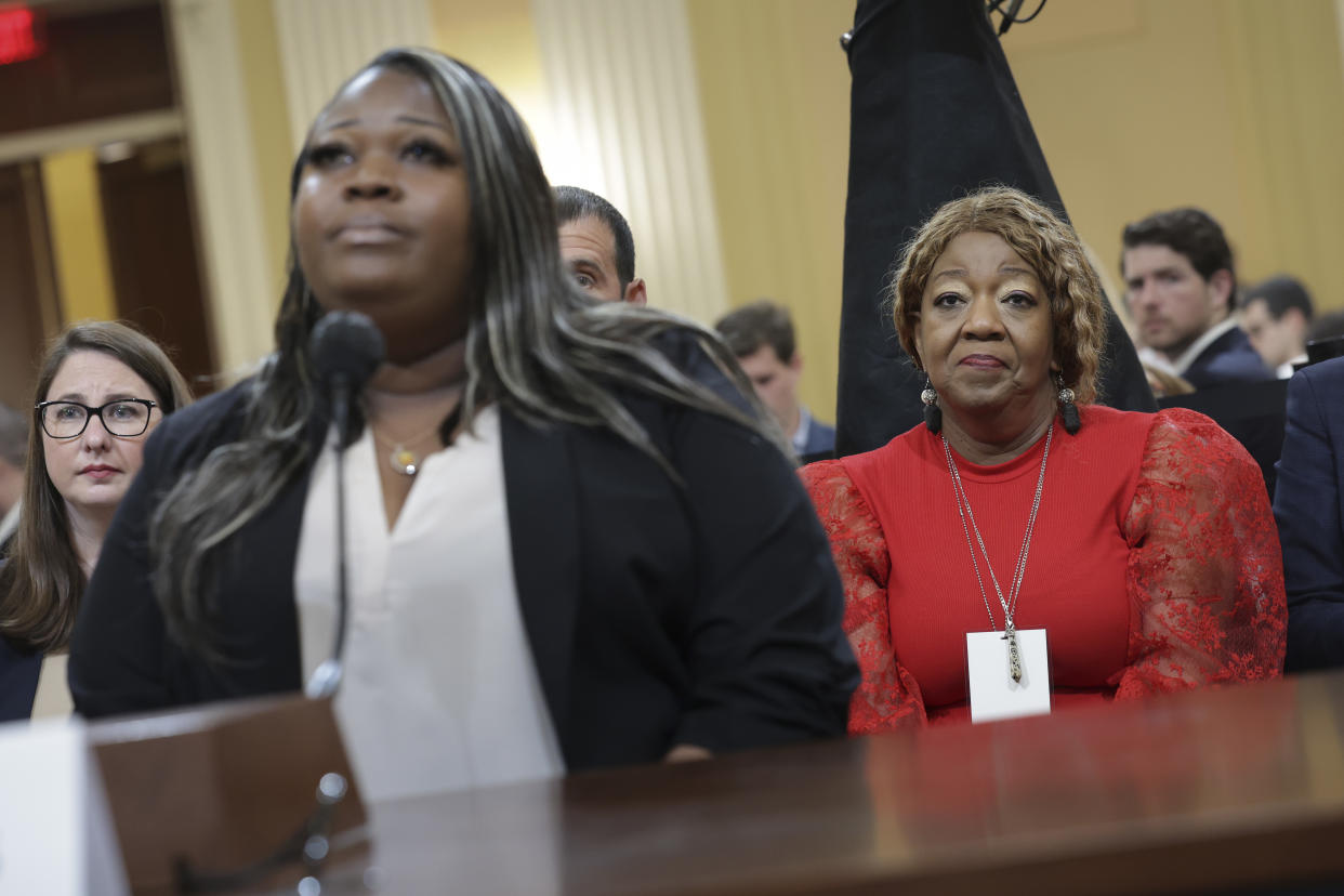 Wandrea ArShaye “Shaye” Moss, at the microphone looking apprehensive, with her mother, Ruby Freeman, looking nervous but resigned, behind her. 