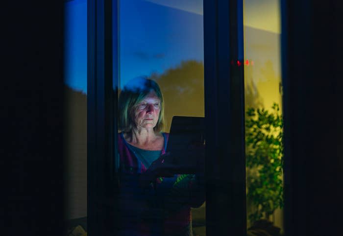 an old woman using her laptop